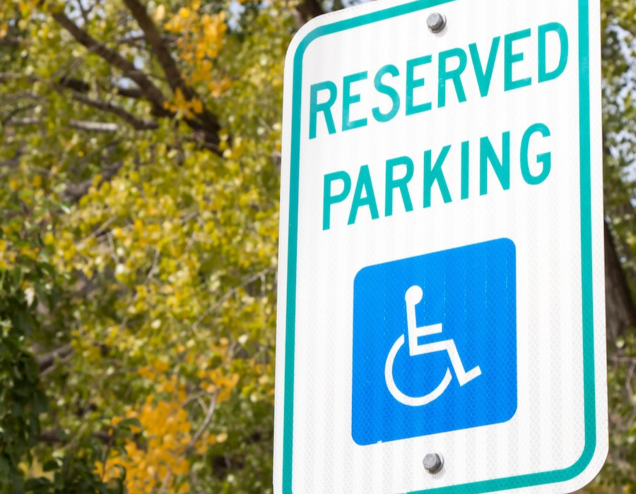 Reserved handicapped parking sign in the autumn