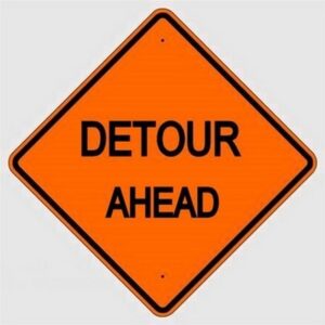 detour ahead work zone sign