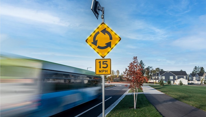 street sign with LED lights on side of road