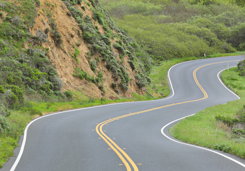 curving road with striped paint